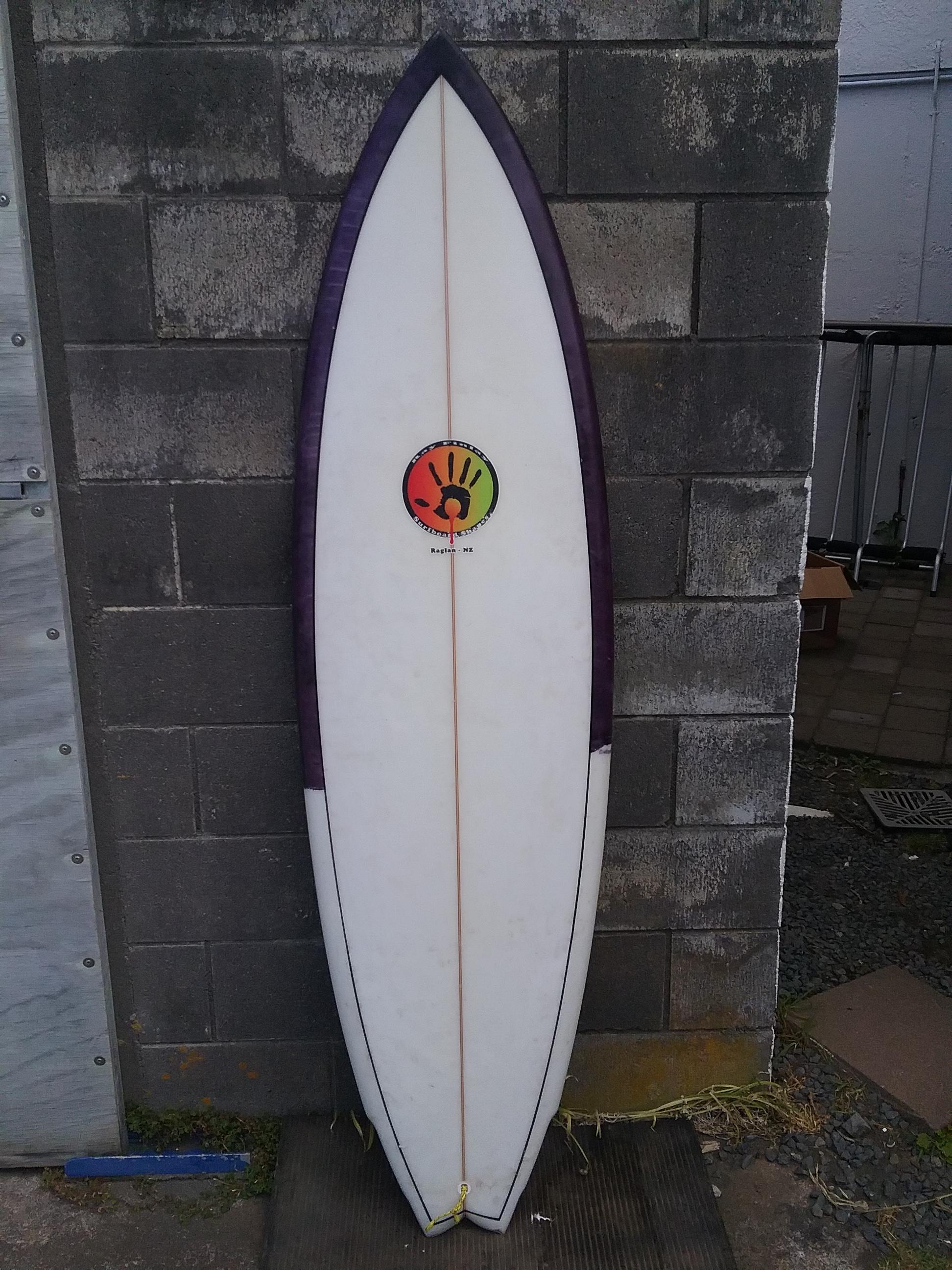 channel bottom twin fin surfboard