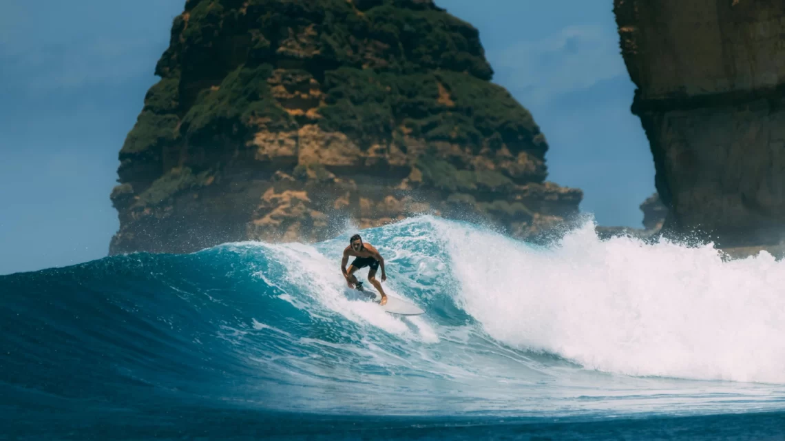 Surfer drops into a wave